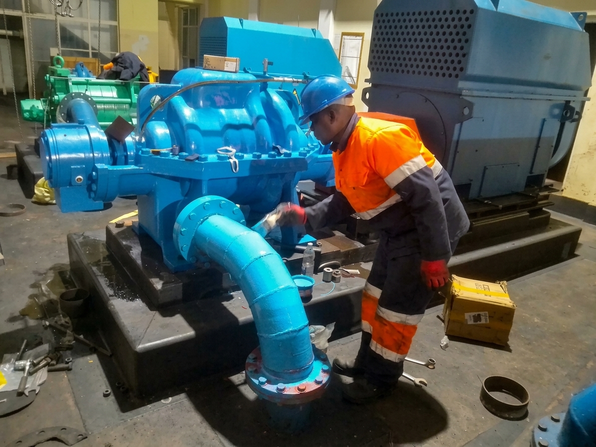 Technician commissioning a centrifugal pump